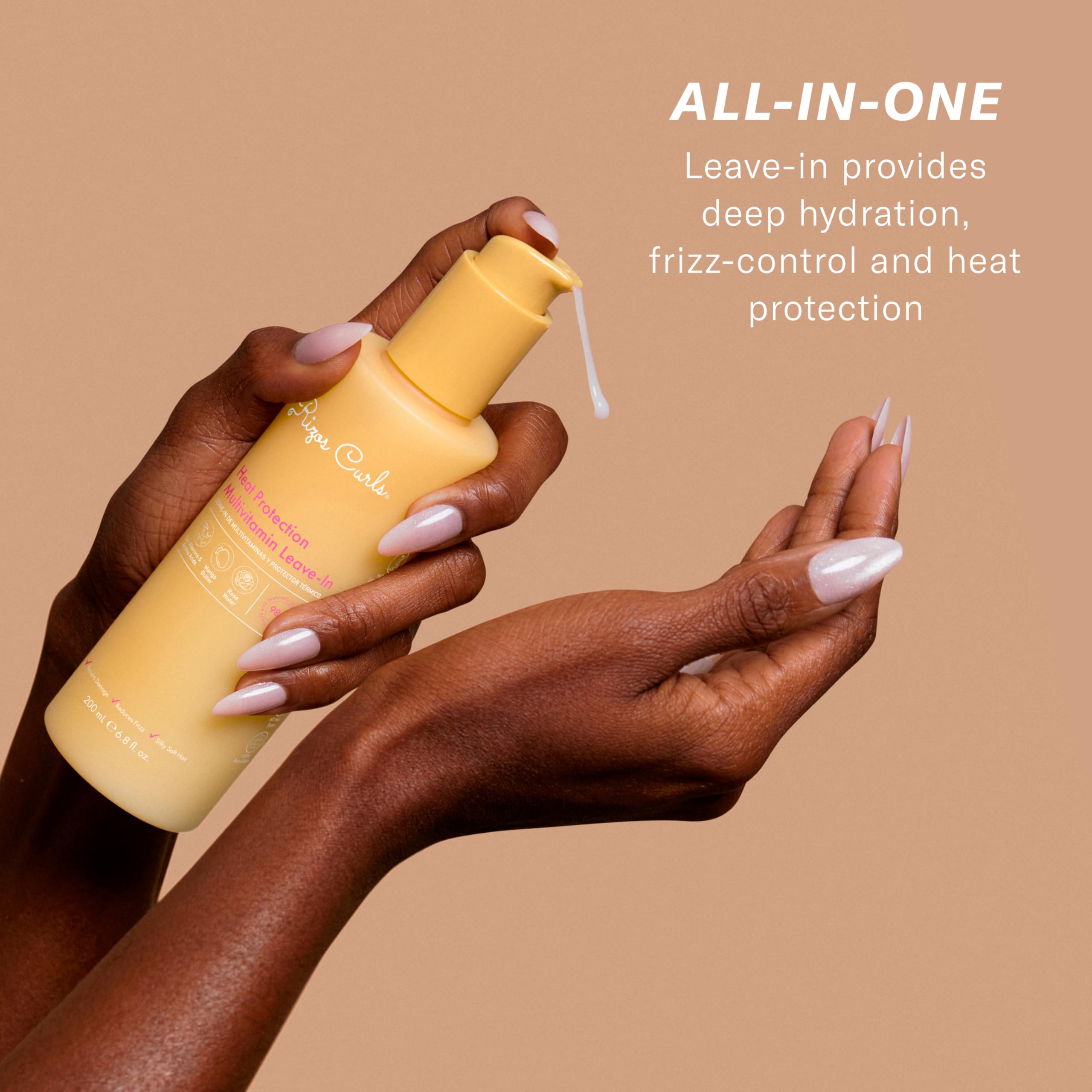 Rizos Curls Multivitamin Leave-In mist application for easy heat styling prep.