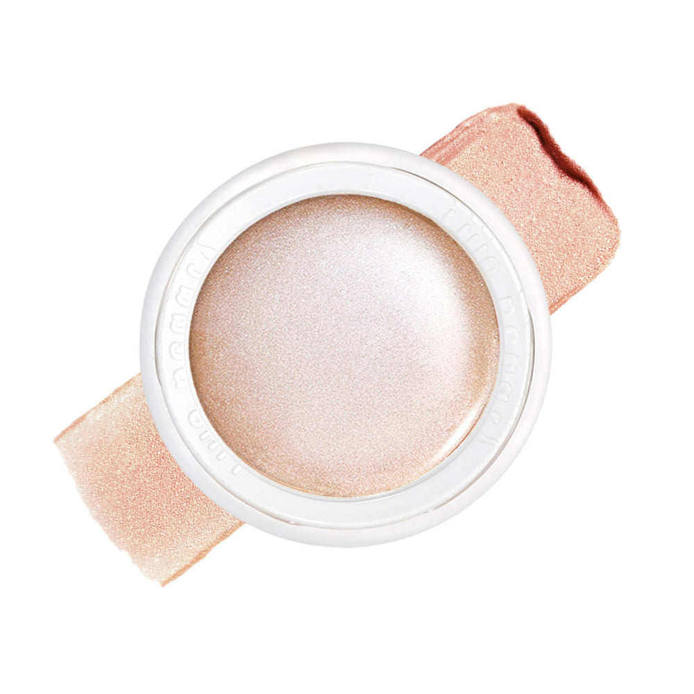 RMS Beauty Luminizer on cheekbones for natural dew and radiance.