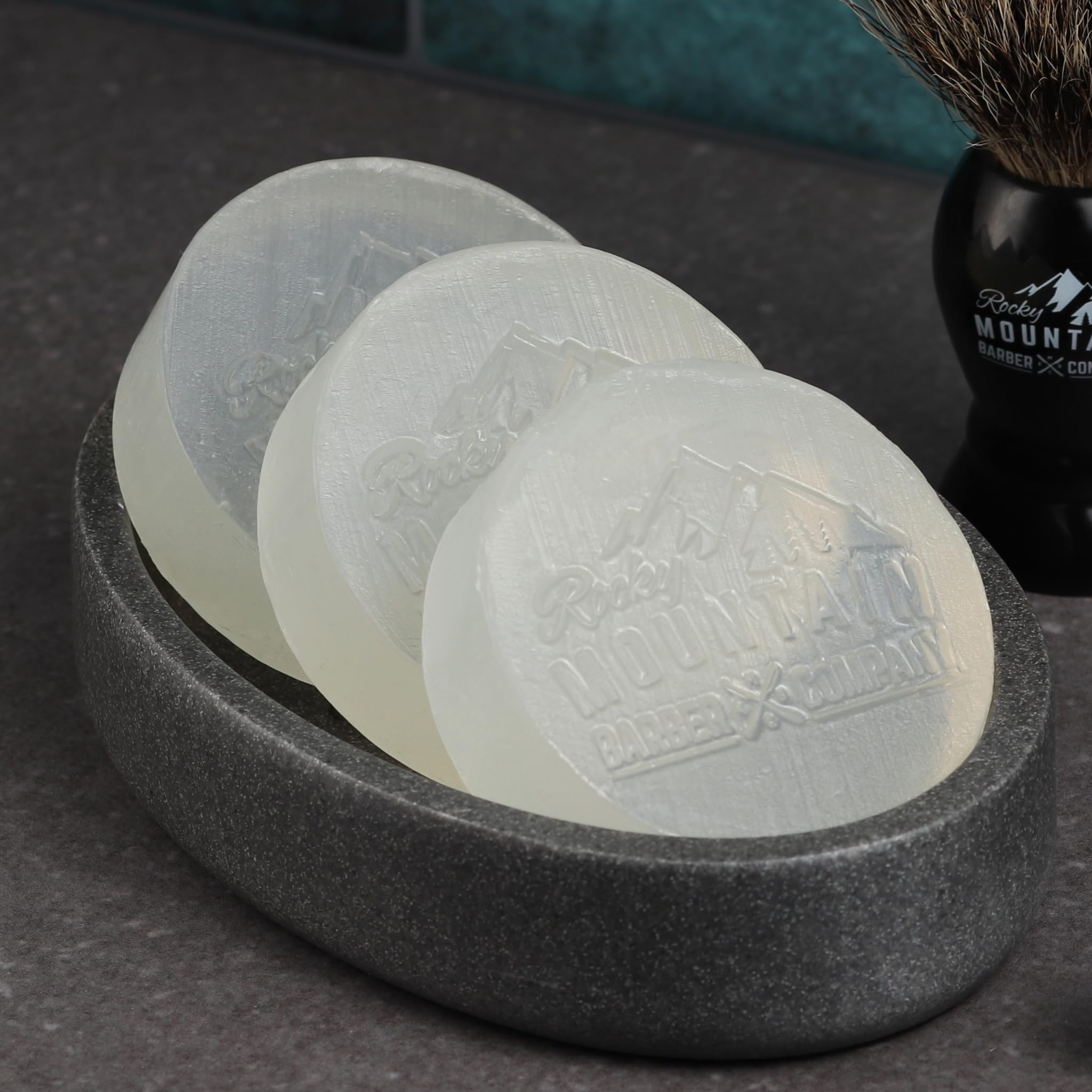 Rocky Mountain Barber Company close-up captures dense lather for smooth razor glides.