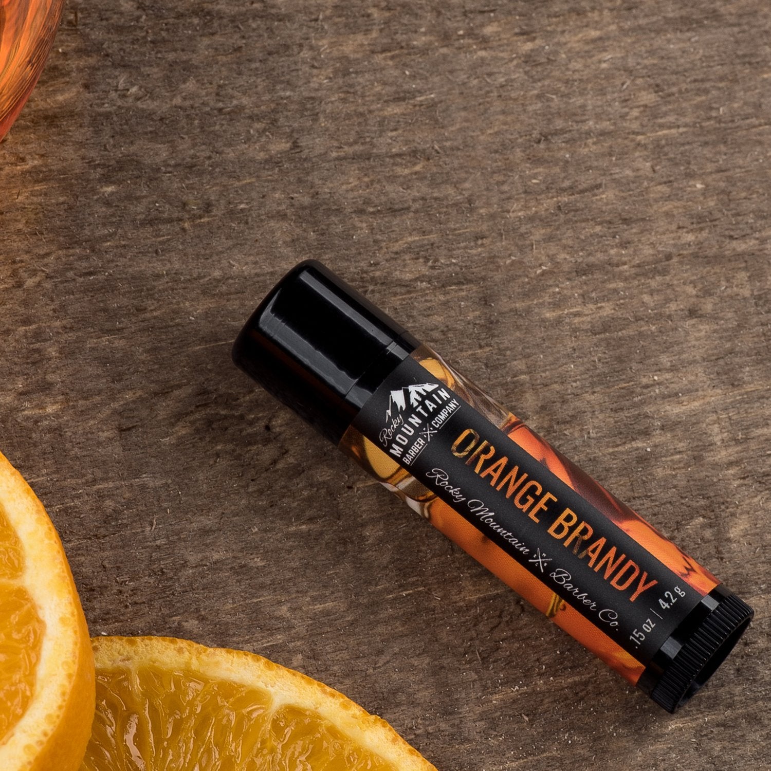 Rocky Mountain Barber orange-brandy lip balm packaging – convenient four-tube set