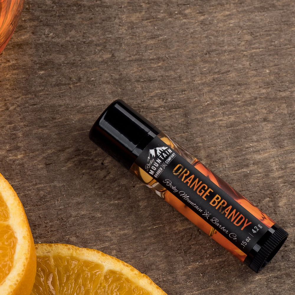 Rocky Mountain Barber orange-brandy lip balm packaging – convenient four-tube set