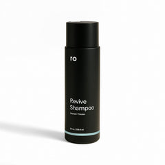 ROMAN Ro Men's Revive Shampoo bottle with minty cleanse for a refreshed scalp and fuller appearance.