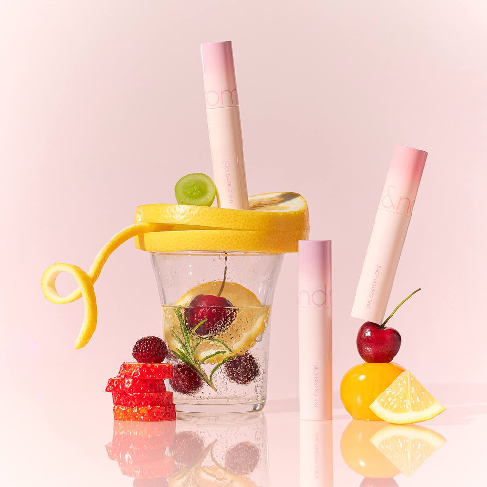 rom&nd Juicy Lasting Tint 31 Bare Apricot glossy finish delivers candy-coated shine.