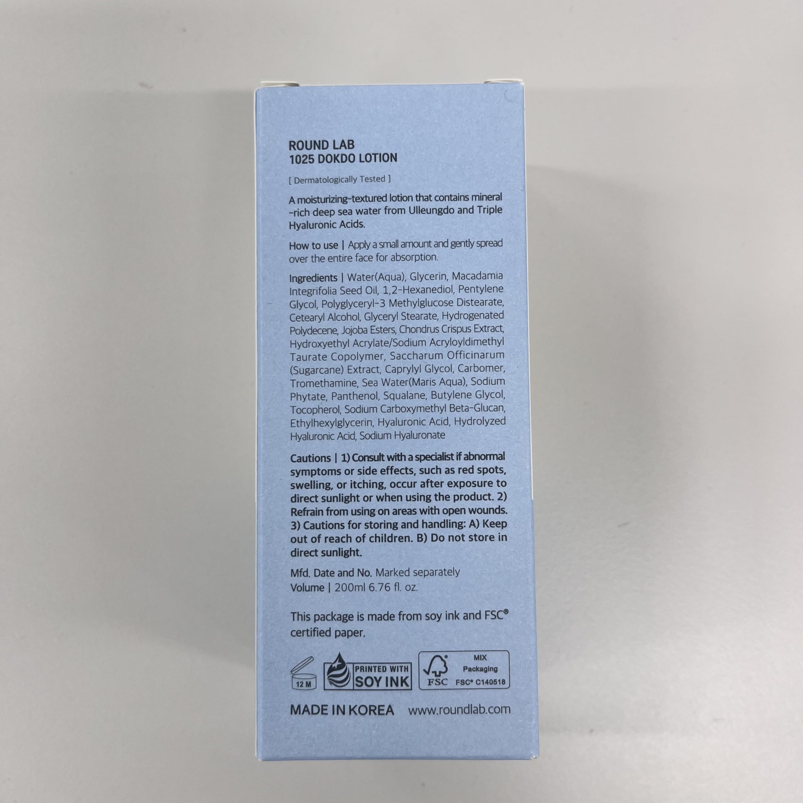 ROUND LAB 1025 Dokdo Lotion closeup of fluid on skin suggests immediate comfortable hydration
