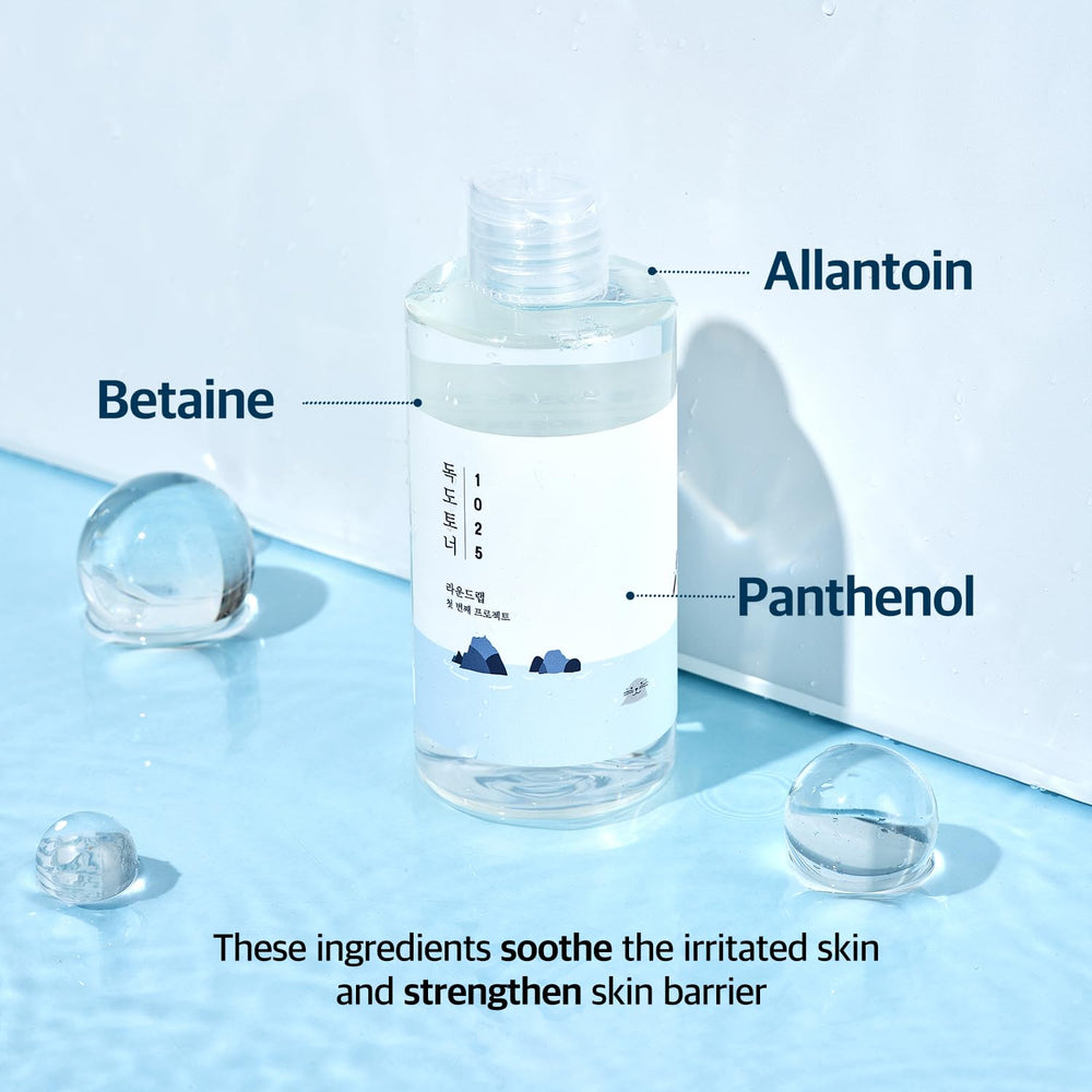 ROUND LAB Dokdo Toner bottle reflected on surface suggests everyday skincare ritual.
