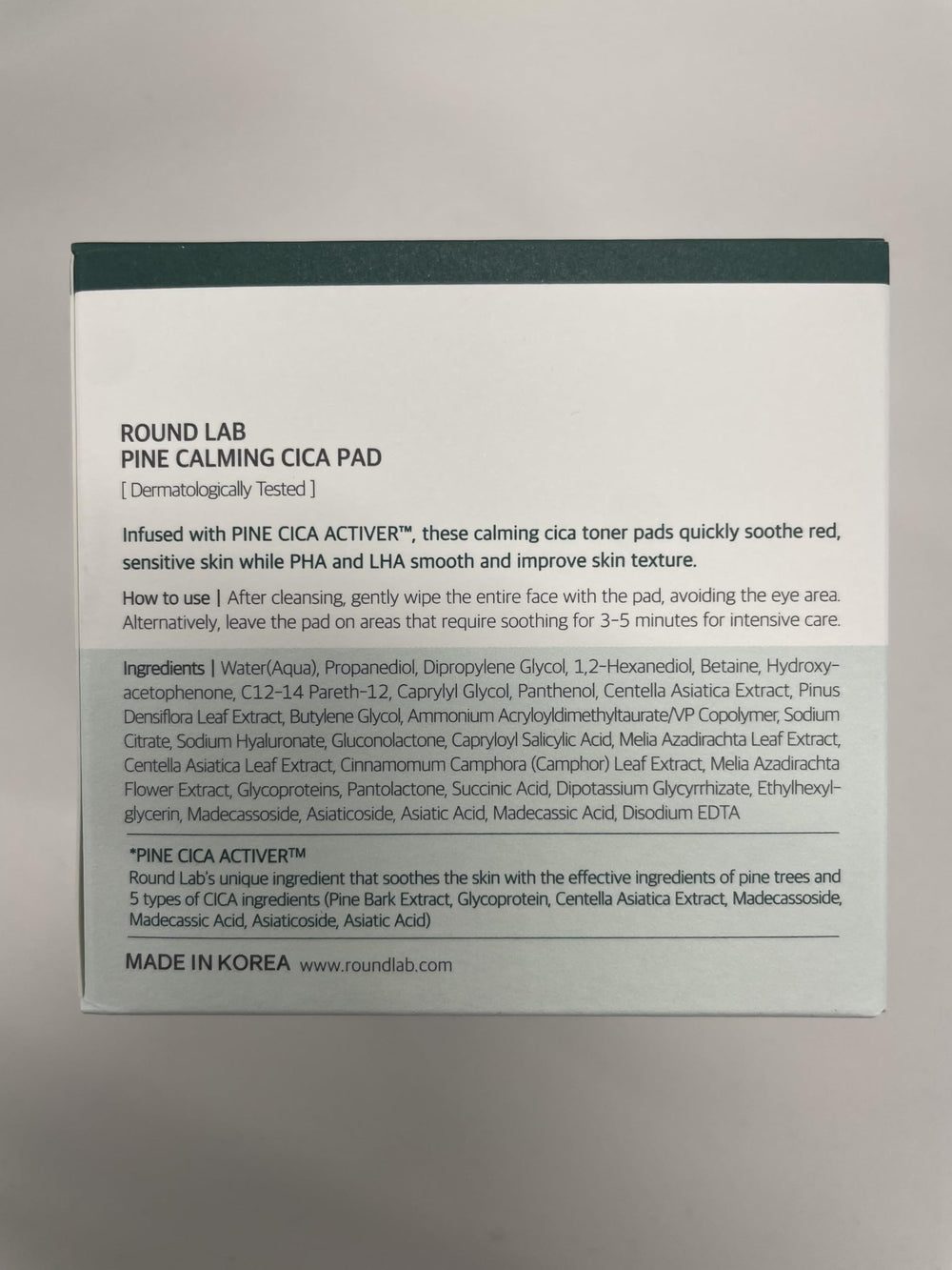 ROUND LAB Pine Calming Cica Pad packaging shown with skincare lineup.
