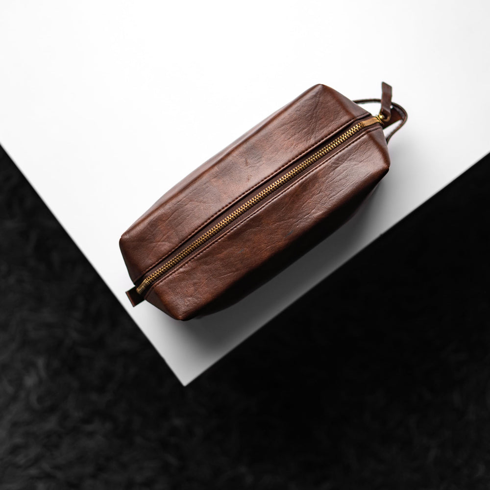 Rubab Men travel-ready pouch on counter demonstrates everyday grooming essentials.