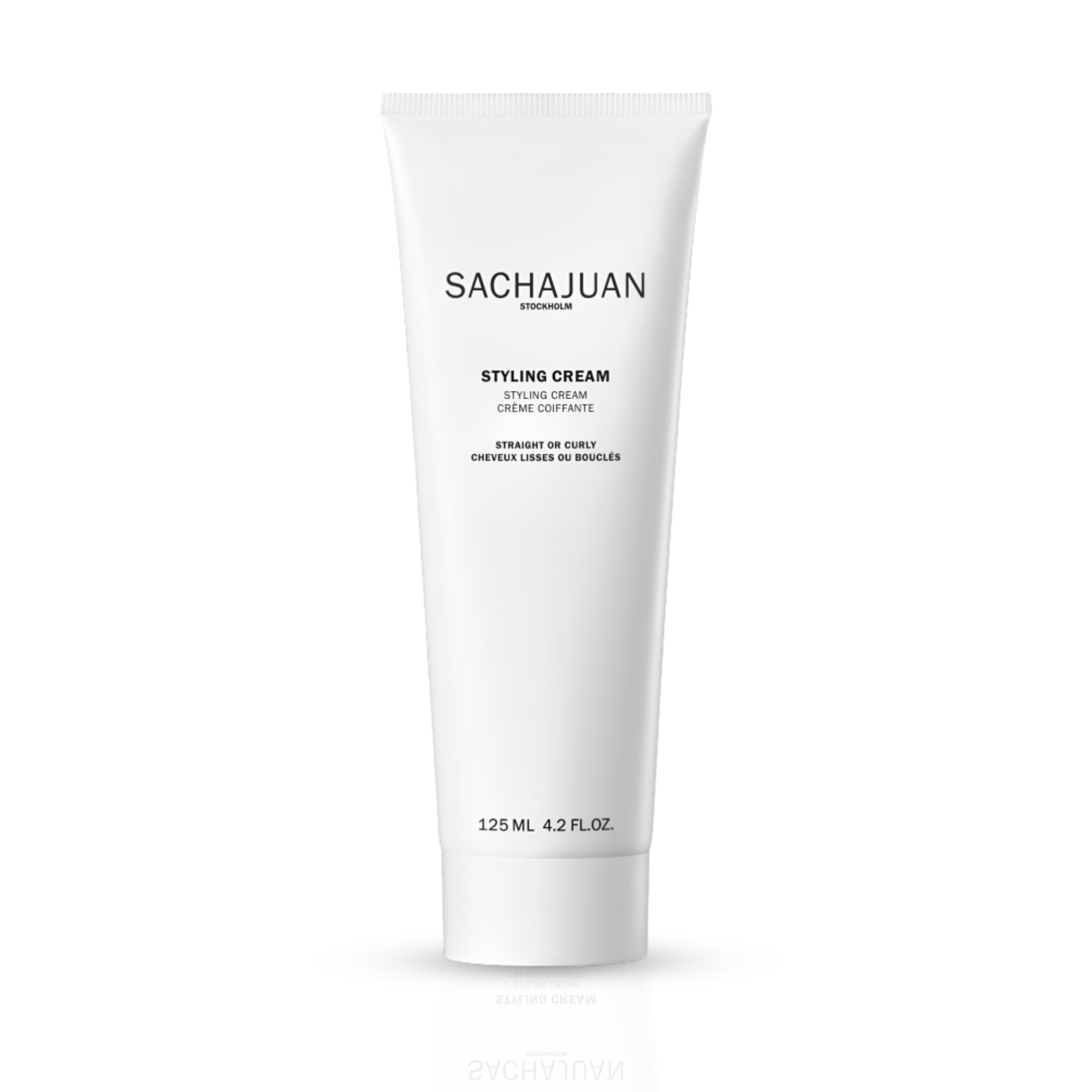 SACHAJUAN Styling Cream bottle closeup for versatile straight or curly styling.