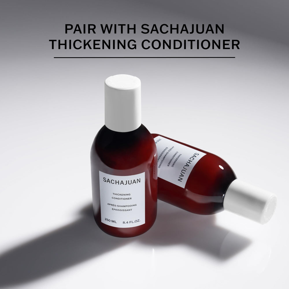 SACHAJUAN Thickening Shampoo lathering in hand shows nourishing texture and gentle cleanse.