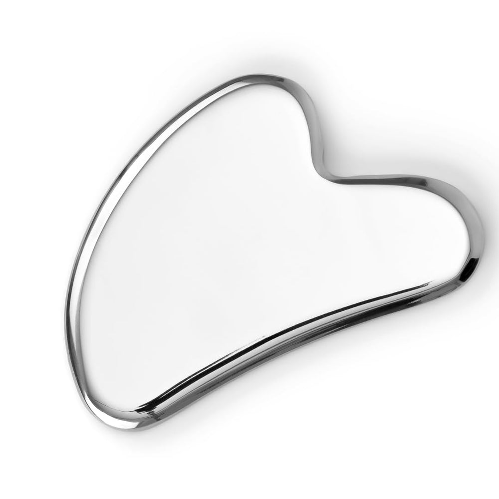 Sacheu Gua Sha face tool close-up demonstrates cooling stainless steel for lymphatic drainage.