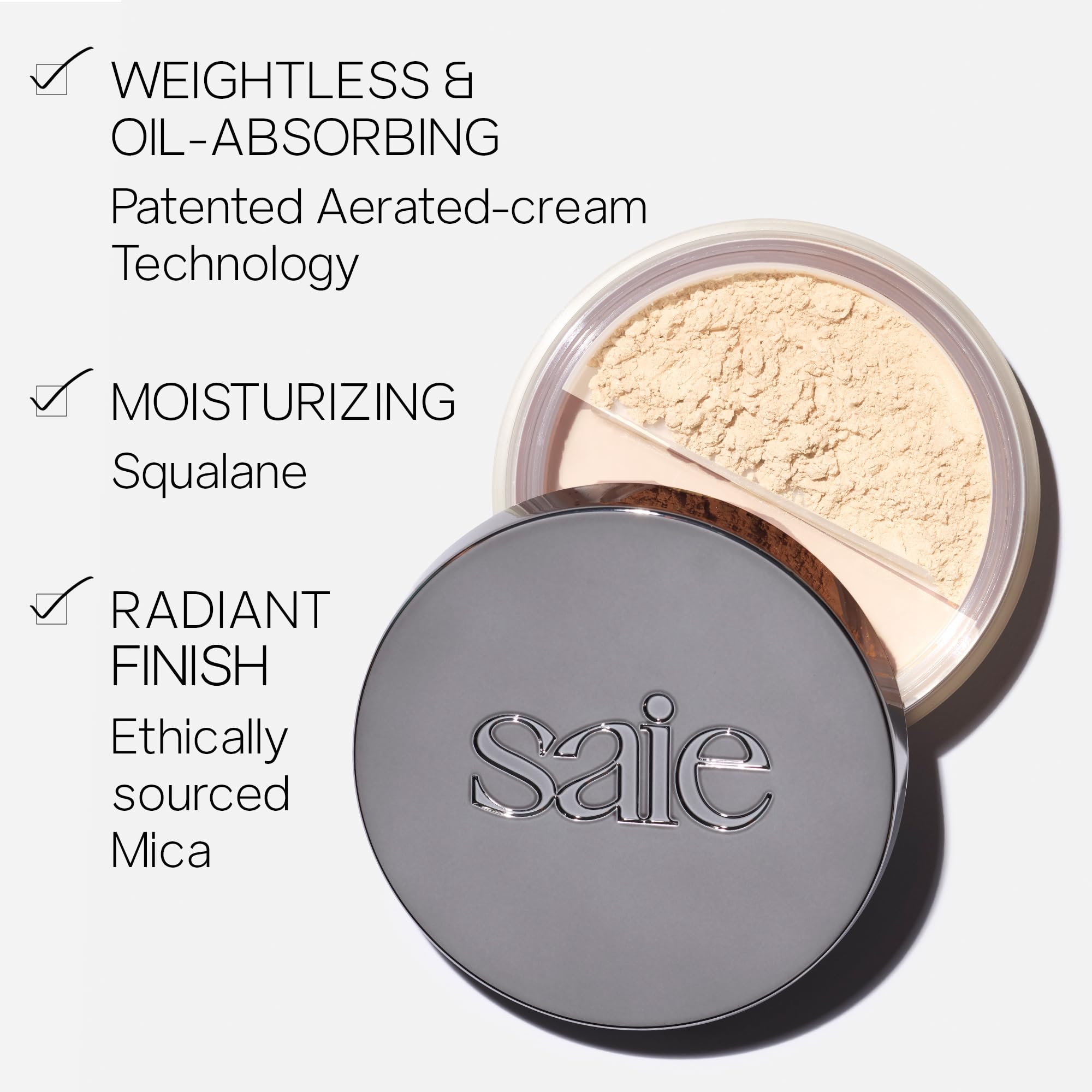 Saie Airset brush application sweeping powder on skin, shows smooth pore-blurring benefit