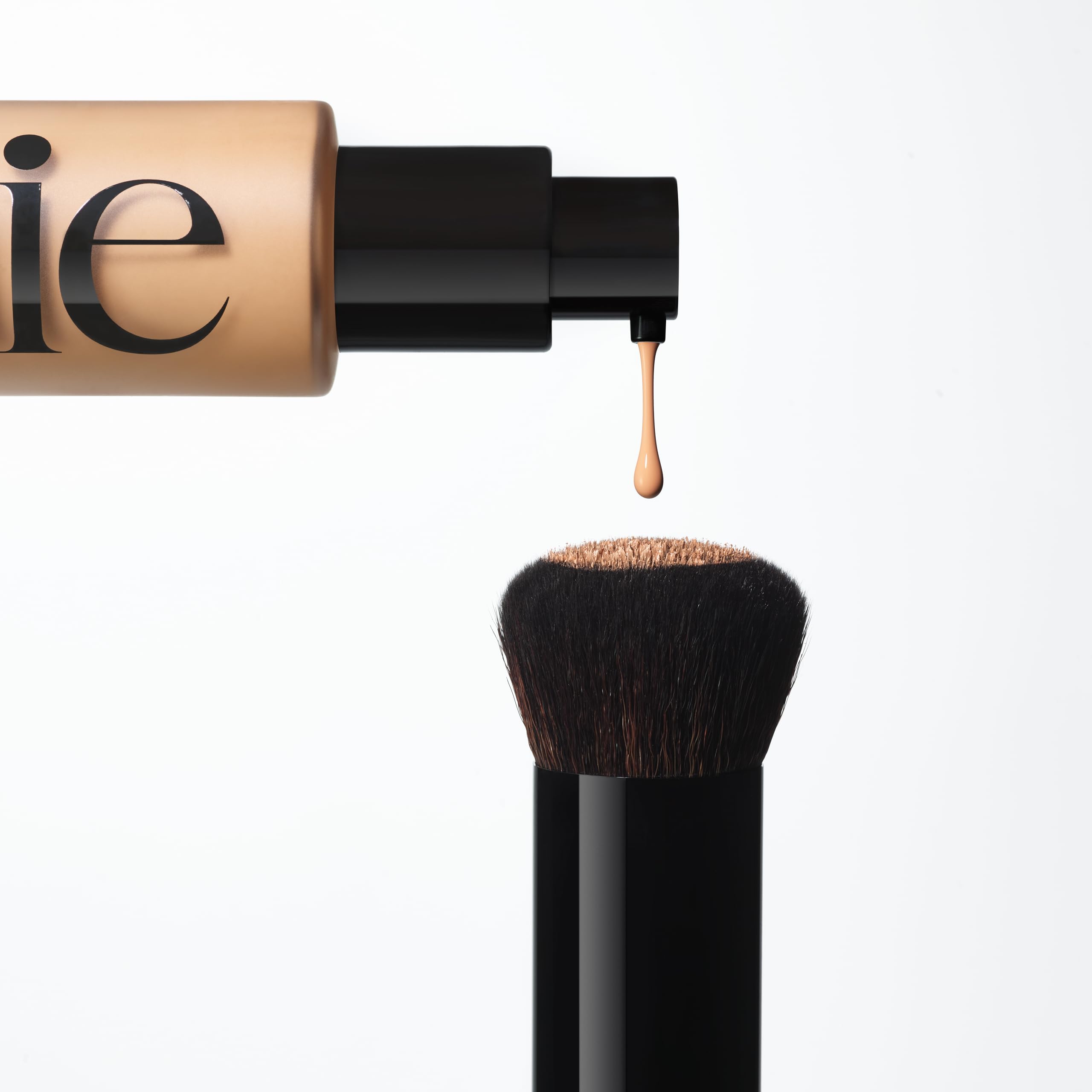 Saie The Base Brush being cleaned with mild soap and water.