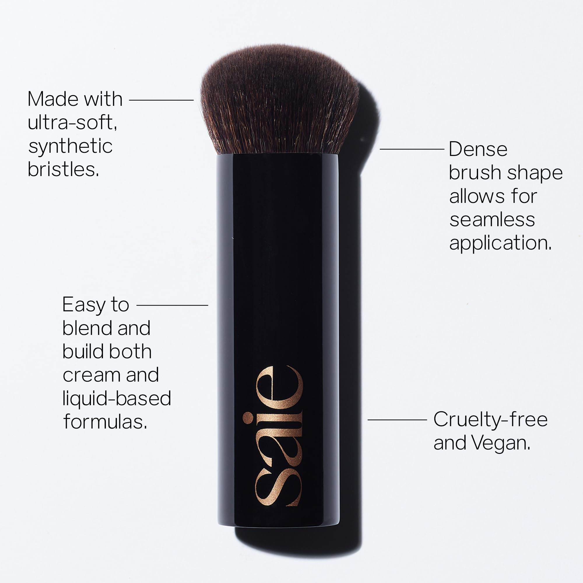 Saie The Big Liquid Foundation Brush applying product with even strokes on cheekbones