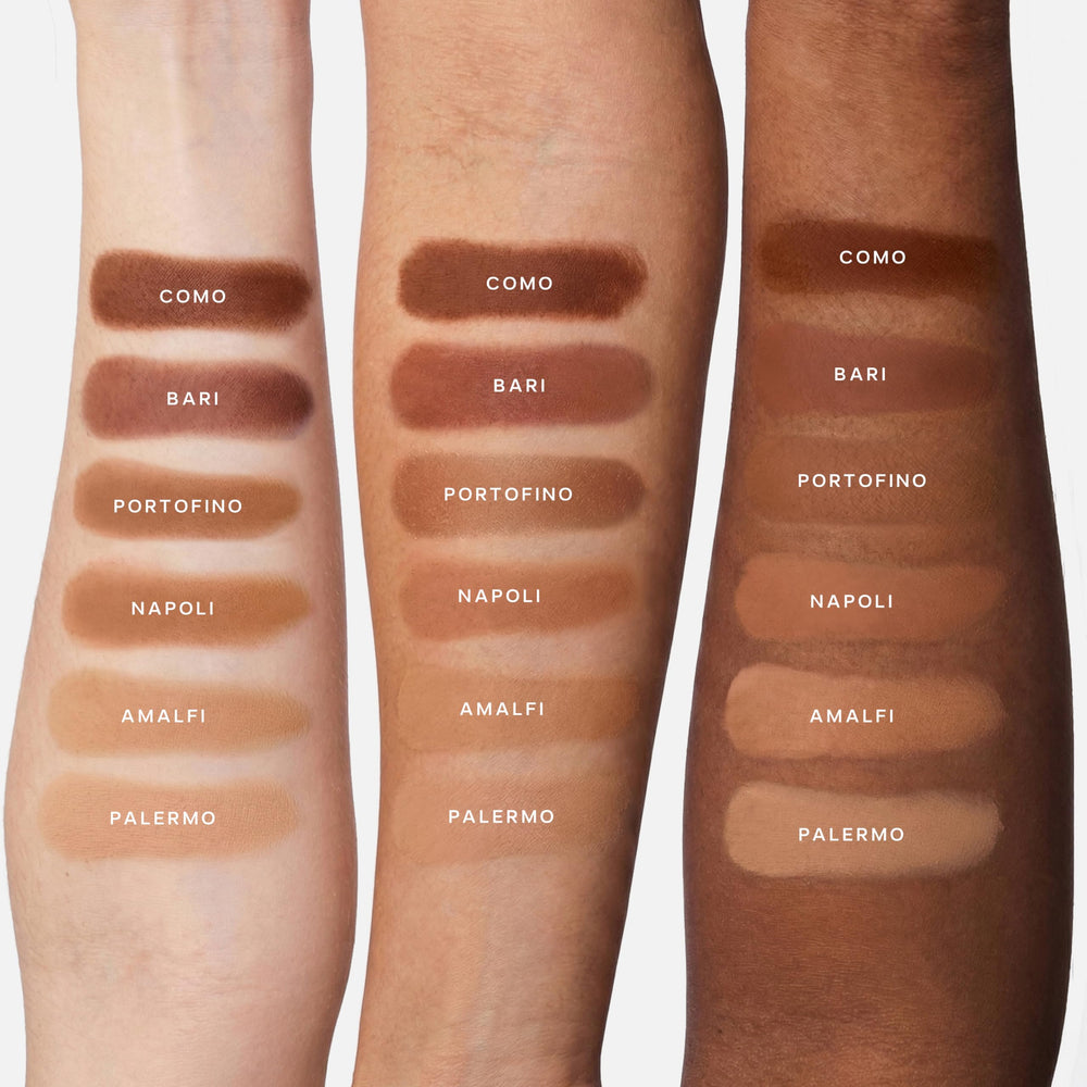 Saie brush applying bronzer to cheek showing blendable formula