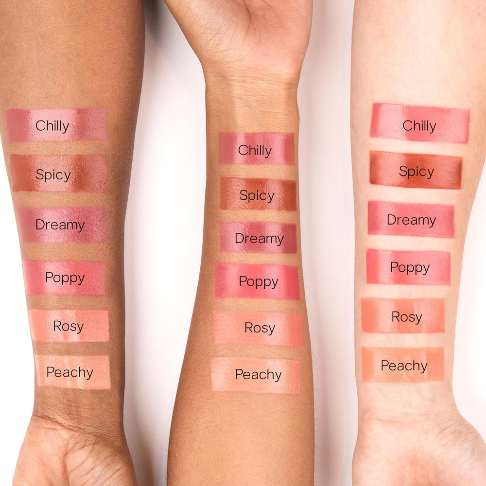 Cheek with dewy glow using Saie Dew Liquid Blush.