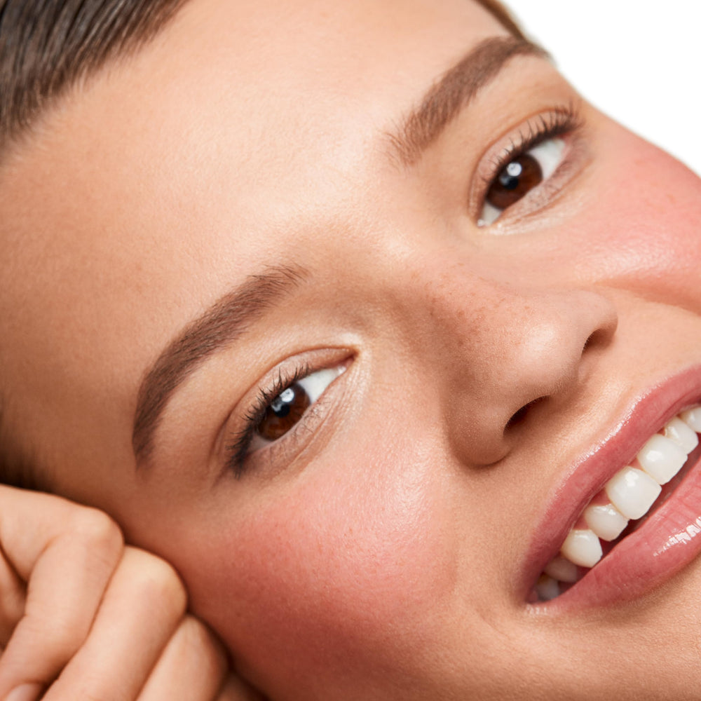 Saie Dew Liquid Blush on cheeks demonstrates a soft, lit-from-within glow.