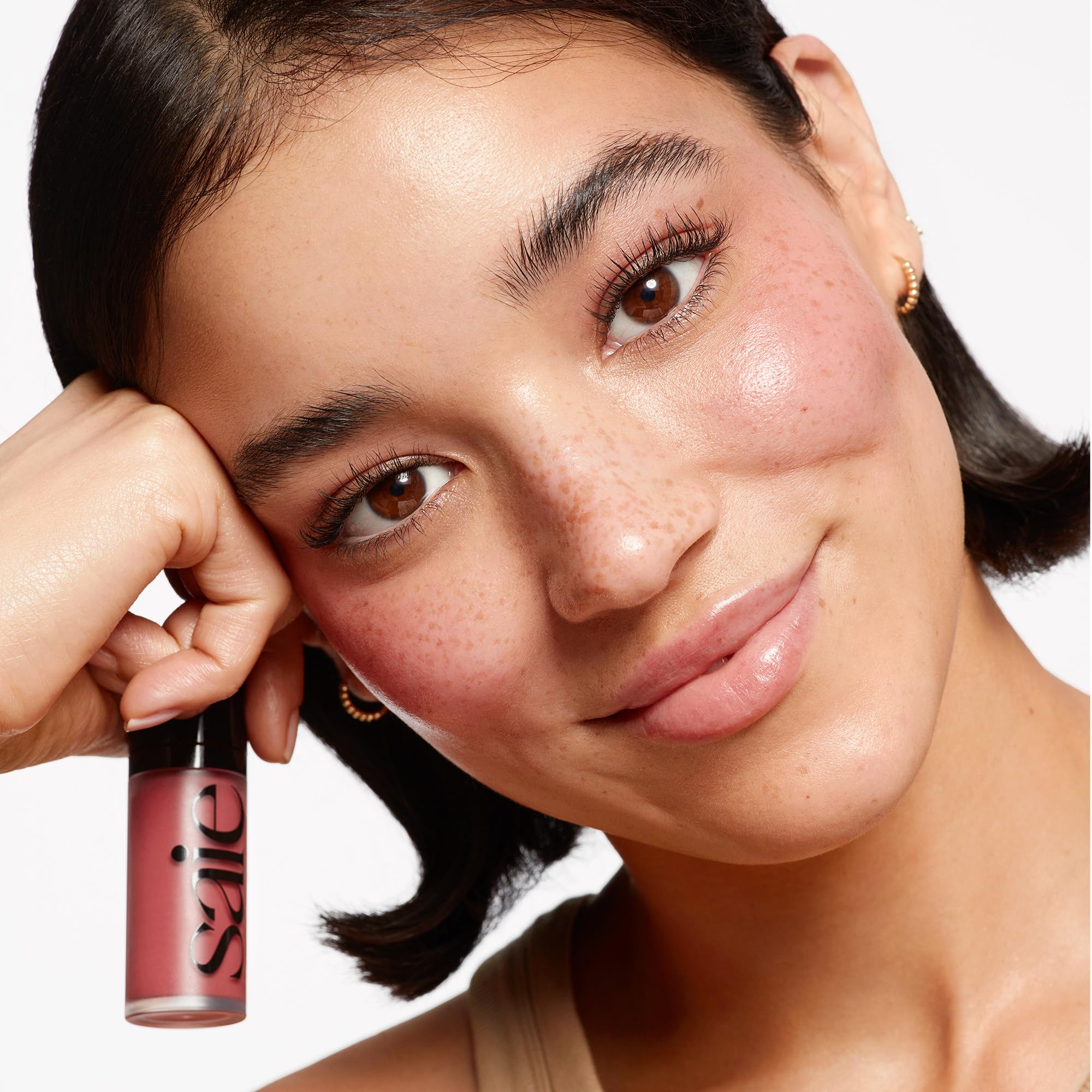 Saie Dew Liquid Blush shade range display on arm
