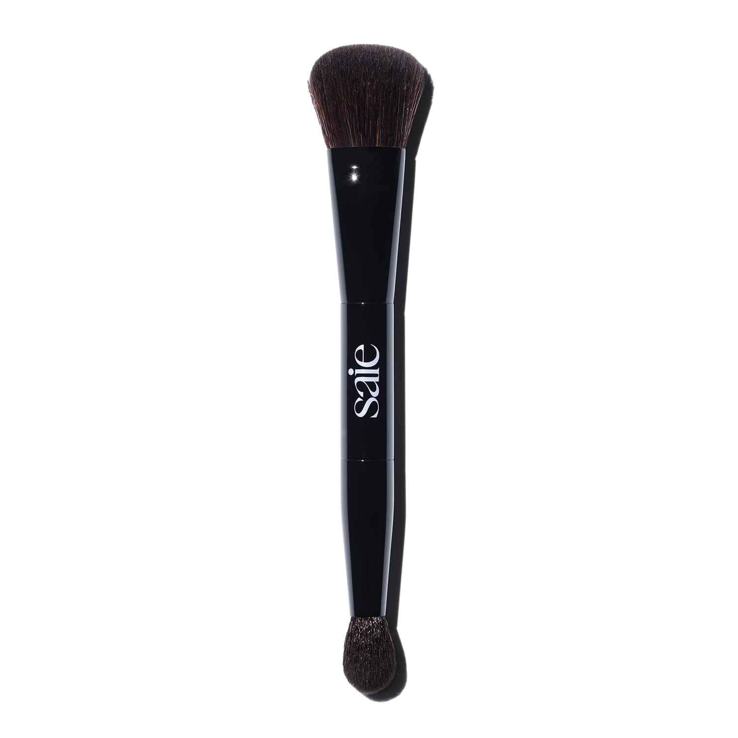 Saie The Double Brush large end for precise sculpting on cheekbones.
