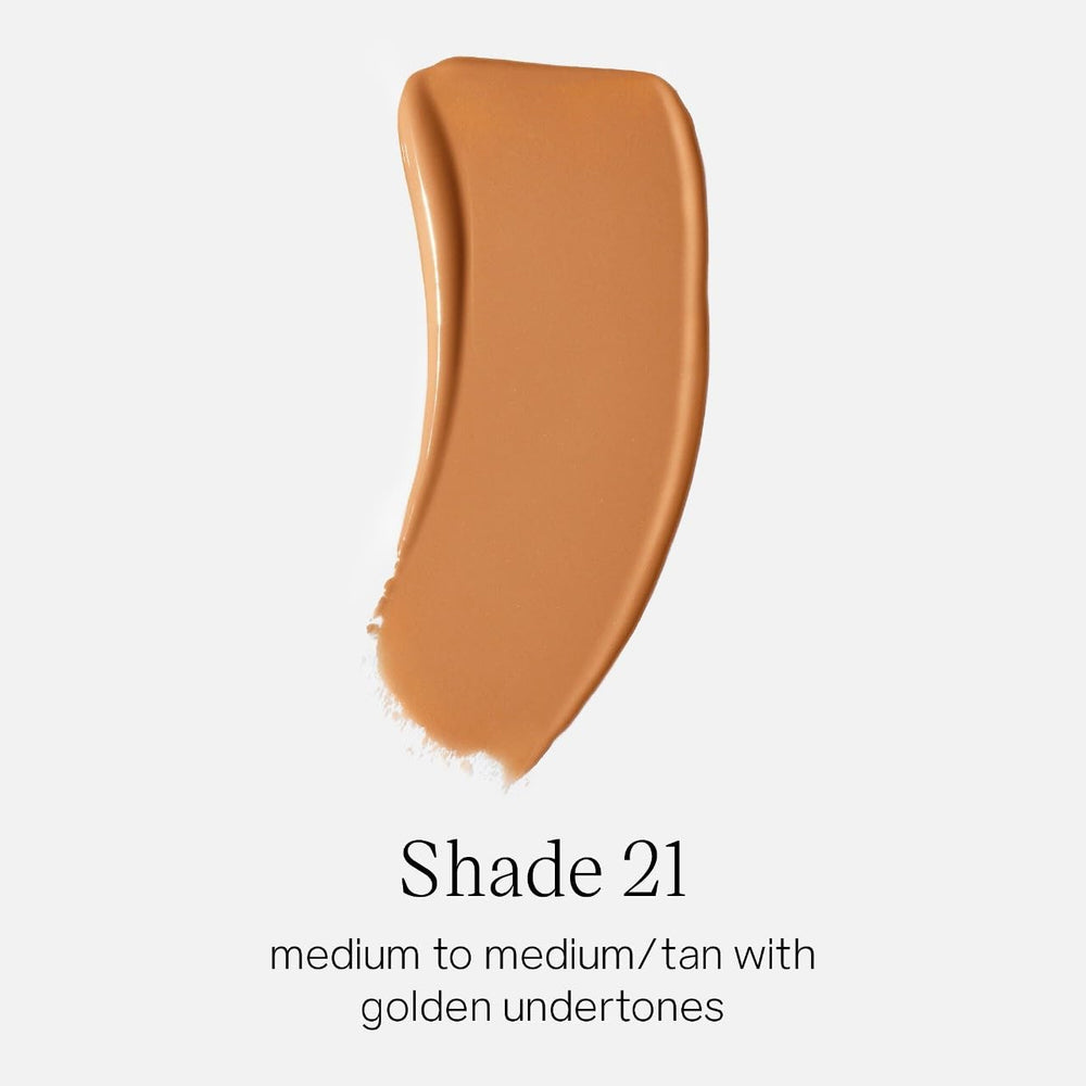 Close-up texture drop of Saie Glowy Super Skin Tint highlighting dewy serum finish