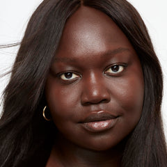 Saie serum texture drop of Glowy Super Skin Tint showing hydrating consistency