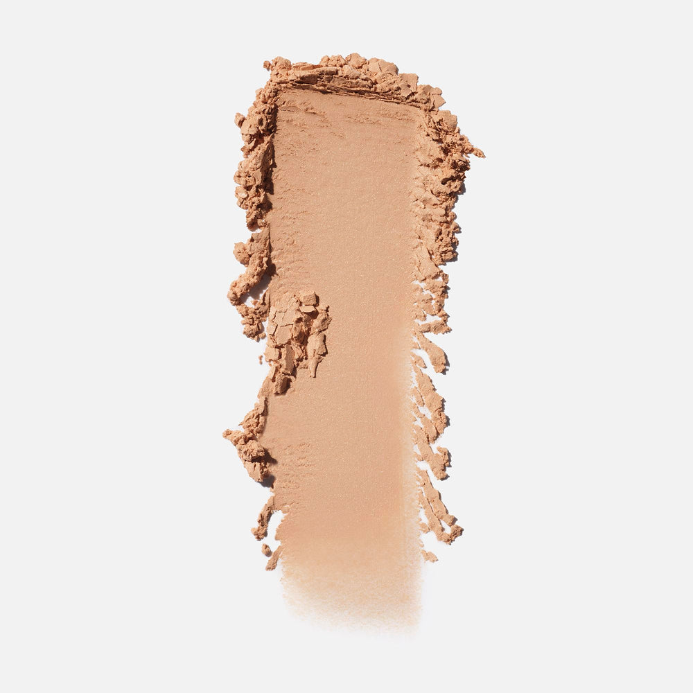 Saie loose powder texture close-up revealing airy particles for smooth, blur effect