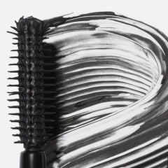 Saie Mini Mascara 101 buildable coats for customizable volume.