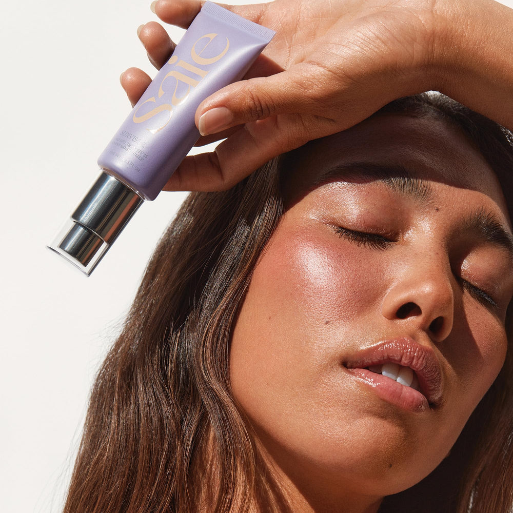 Saie Mini Sunvisor in a bag outdoors illustrating on-the-go SPF protection and glow