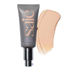 Saie Slip Tint bottle pour demonstrates easy, wearable SPF and hydration on the go.