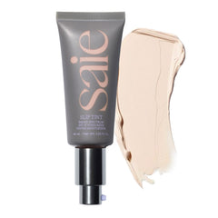 Saie Slip Tint SPF 35 bottle closeup shows hydrating tint for dewy skin