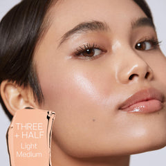 Saie Slip Tint skin swatch on arm reveals light to medium golden glow.