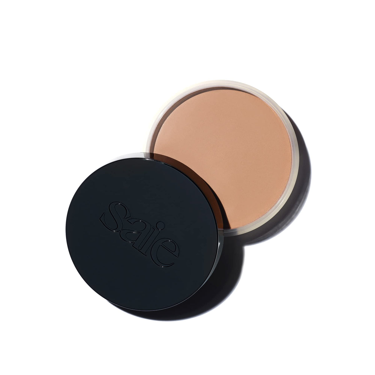 Saie Sun Melt front packaging showing product jar and shade label, highlighting portability