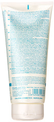 Salerm 21 B5 Silk Protein Leave-In Conditioner close-up on bottle label highlighting heat and sun protection.