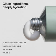 Close-up of Neroli & Basil lotion texture showing silky finish.