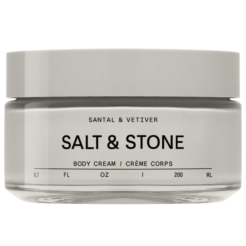 Salt & Stone Body Cream Santal & Vetiver bottle pouring rich hydration.
