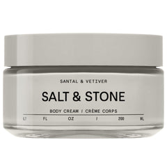 Salt & Stone Body Cream Santal & Vetiver bottle pouring rich hydration.