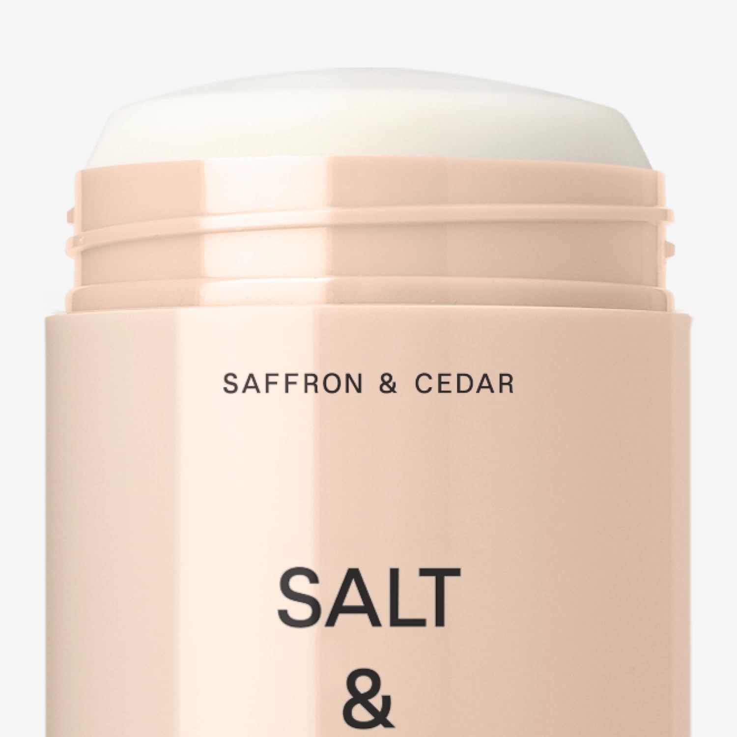 Salt & Stone saffron cedar scent close-up on packaging evokes ocean-meets-mountain vibe