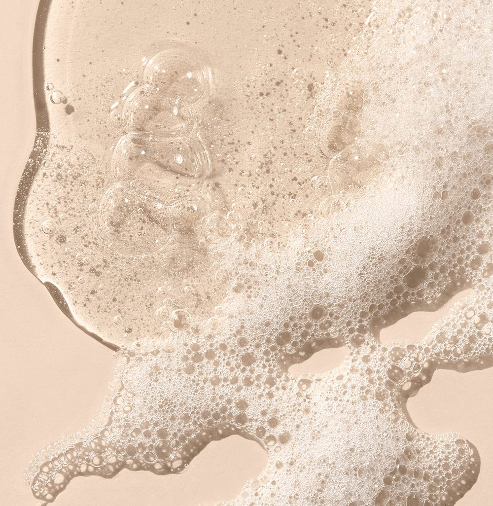 Saltair Moisture Bound shampoo lather observed on hair strands emphasizing cleansing and hydration