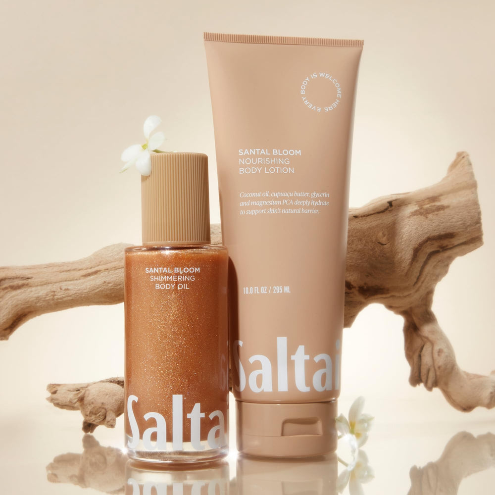 Saltair Shimmering Oil hand application scene suggesting soft, velvety skin after use.