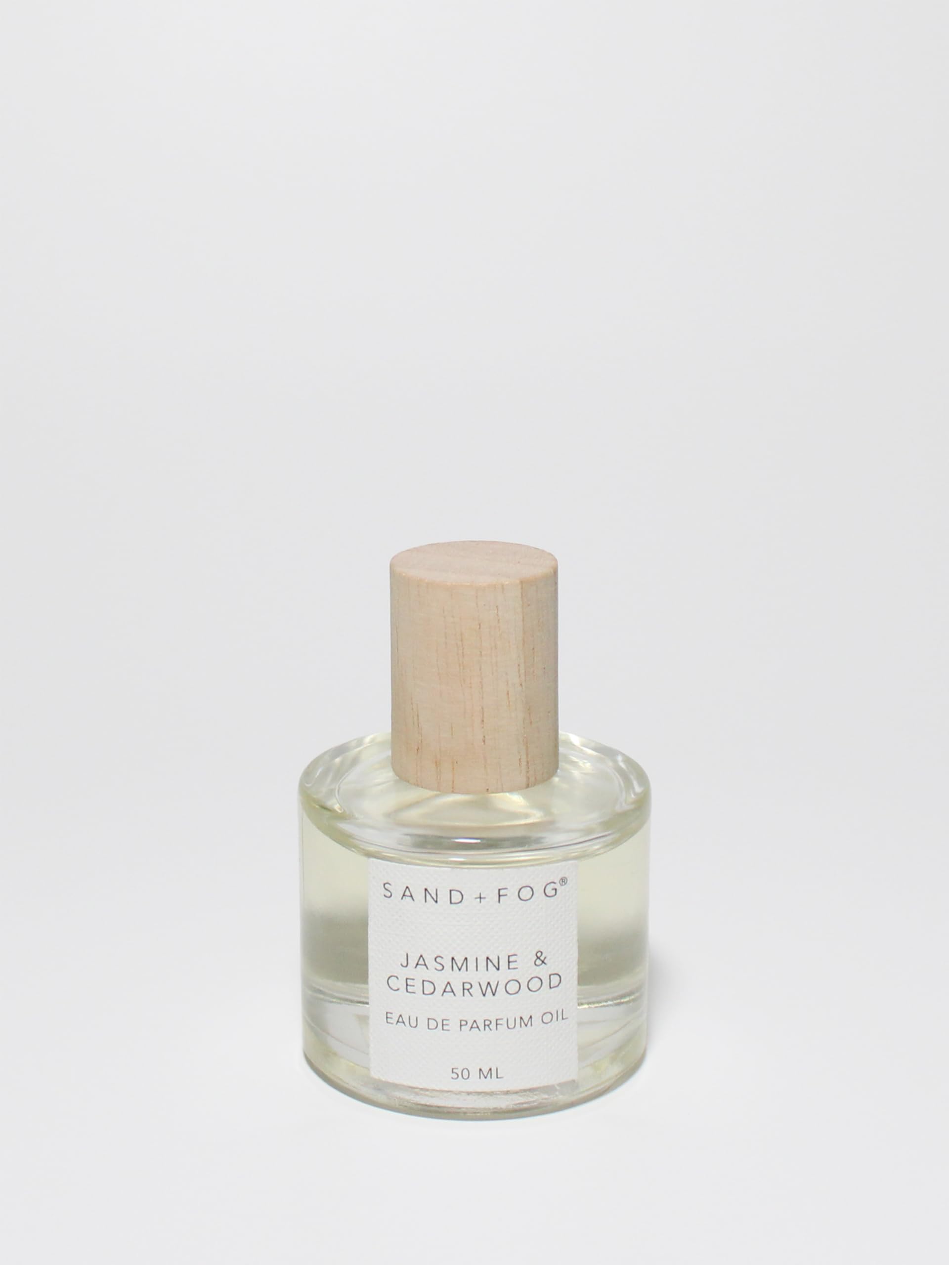 Sand + Fog Jasmine Cedarwood rollerball bottle delivers long-lasting fragrance.