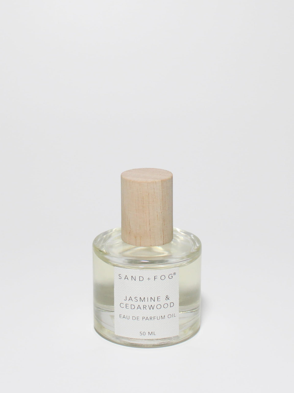 Sand + Fog Jasmine Cedarwood rollerball bottle delivers long-lasting fragrance.