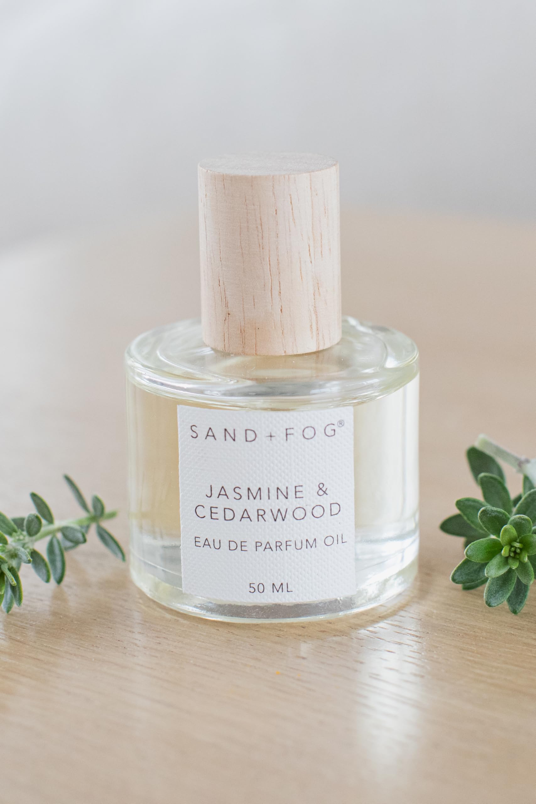 Sand + Fog rollerball application on skin for on-the-go scent.