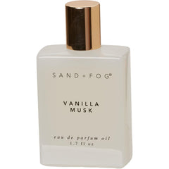 Sand + Fog Vanilla Musk rollerball bottle delivering long-lasting warmth for on-the-go scent.