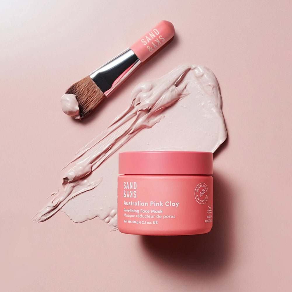 Sand & Sky pink clay mask texture spread on skin in smooth layer
