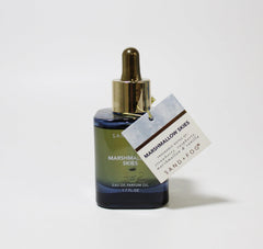 Sand + Fog Marshmallow Skies dark-glass bottle protects fragrance from light.