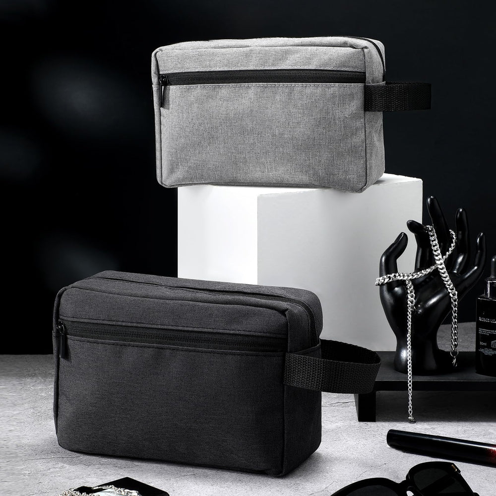 Sanwuta dark blue toiletry bag showing side handle for easy grab-and-go travel.