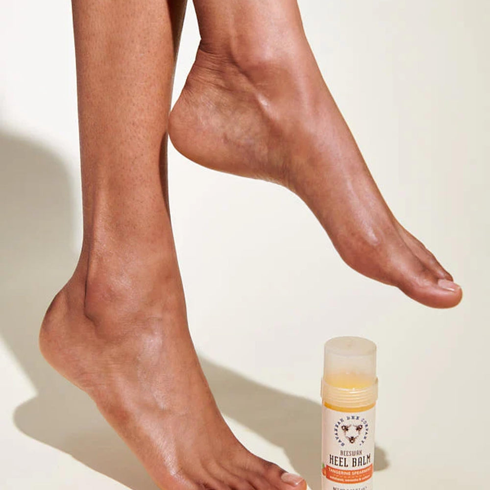 Savannah Bee Company Beeswax Heel Balm ingredients display natural oils and honey.