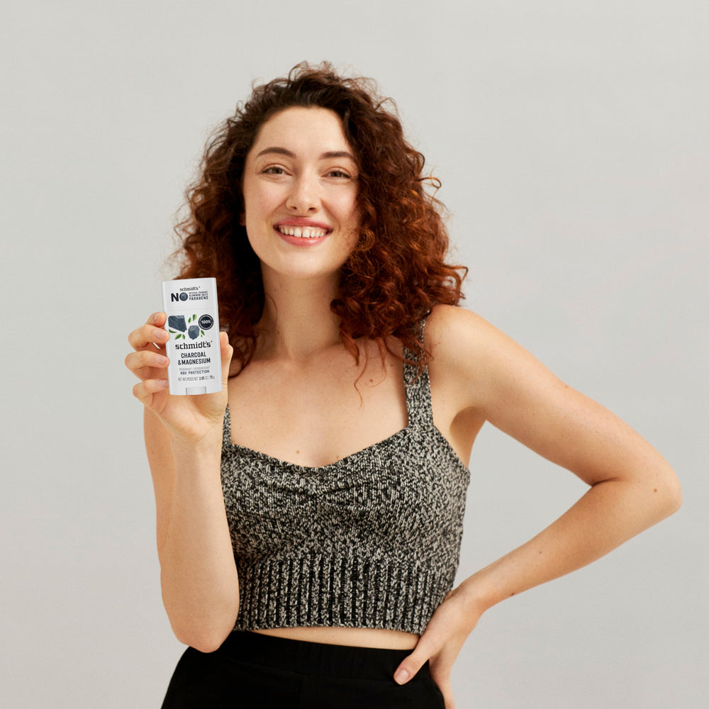 Schmidt's natural-origin fragrance bottle emphasizing 100% plant-derived fragrance.