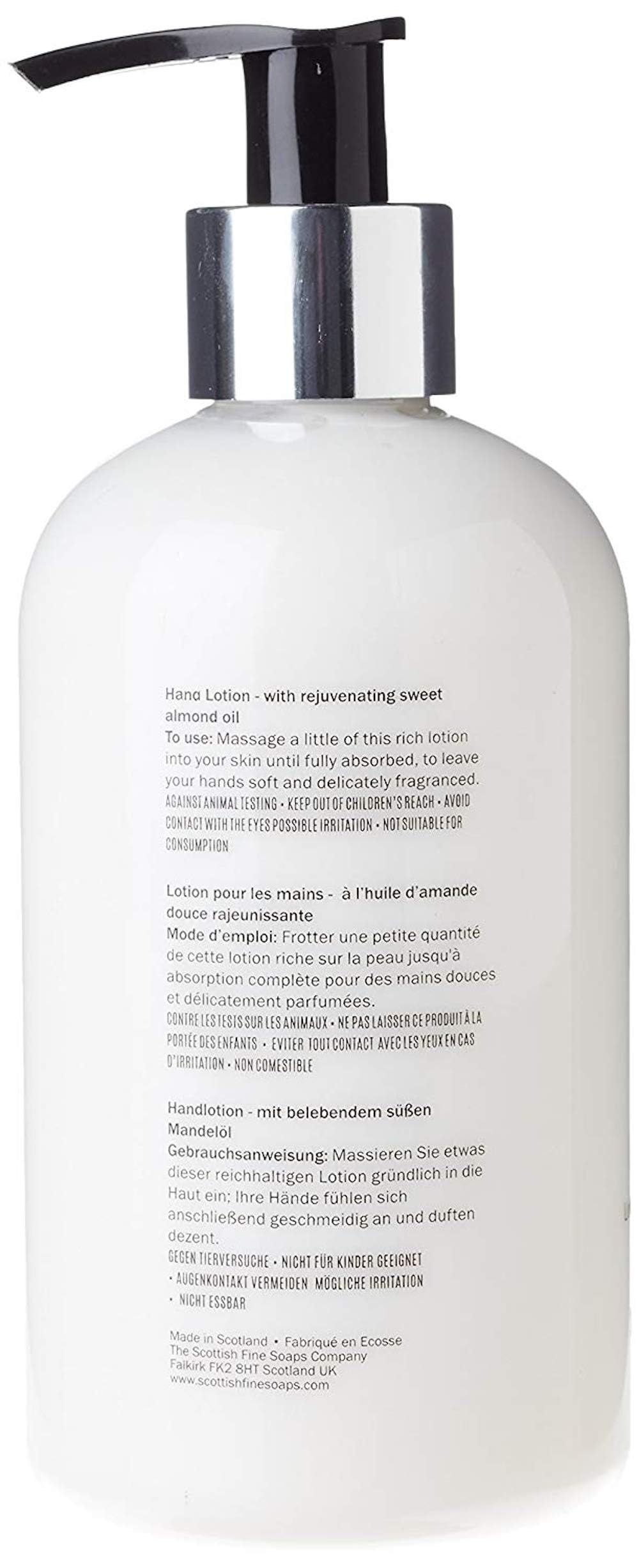 Scottish Fine Soaps Au Lait Hand Lotion on bathroom shelf for hydrating hands.
