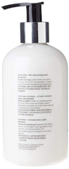 Scottish Fine Soaps Au Lait Hand Lotion on bathroom shelf for hydrating hands.