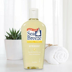 Sea Breeze Astringent Original 10oz with cotton pad for nightly skincare ritual